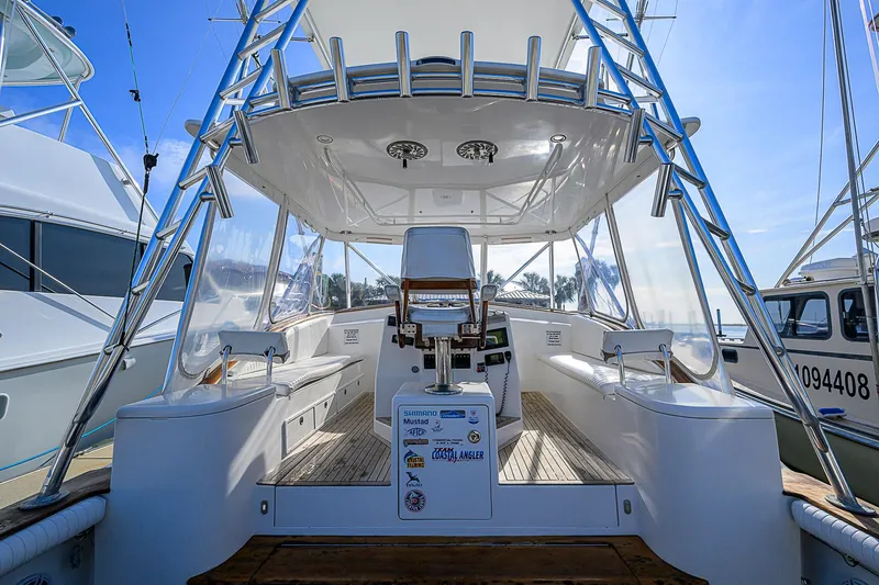 Slide: The Image of 2008 Jersey Cape Devil 36 boat interior with seating and helm station. - 9