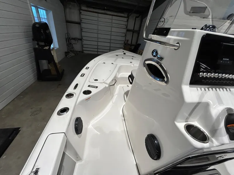 Slide: The Image of 2025 Sea Pro 210 Bay boat interior with modern dashboard and seating. - 12