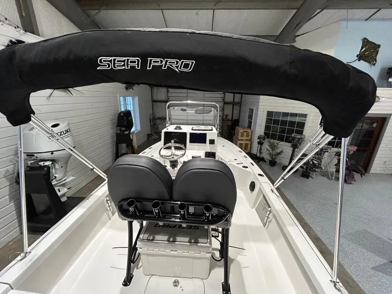 Slide: The Image of 2025 Sea Pro 210 Bay boat interior with seating and console. - 15