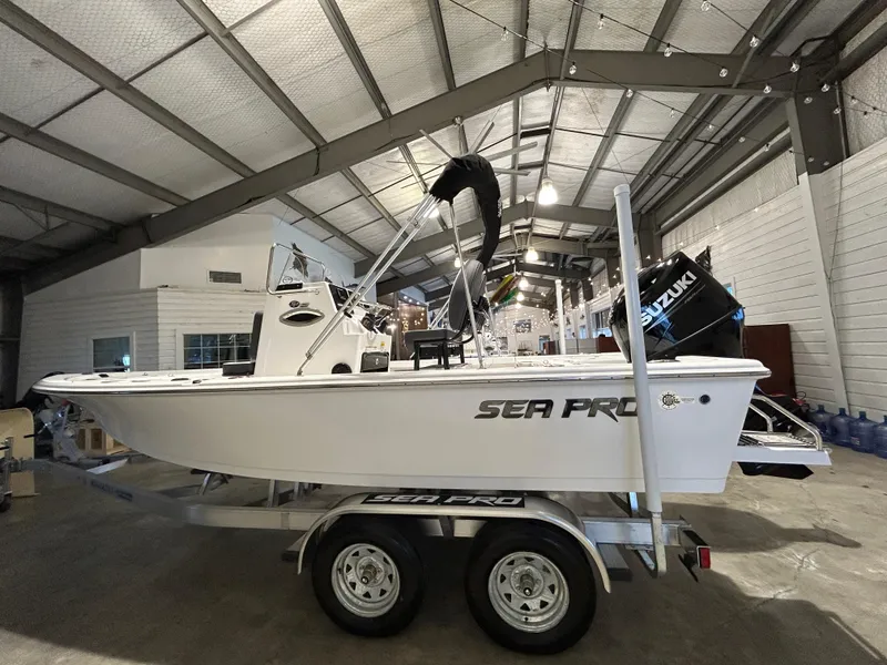 Slide: The Image of 2025 Sea Pro 210 Bay boat on trailer in indoor showroom. - 3