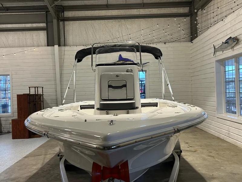 Slide: The Image of 2025 Sea Pro 210 Bay boat in indoor showroom, front view. - 4