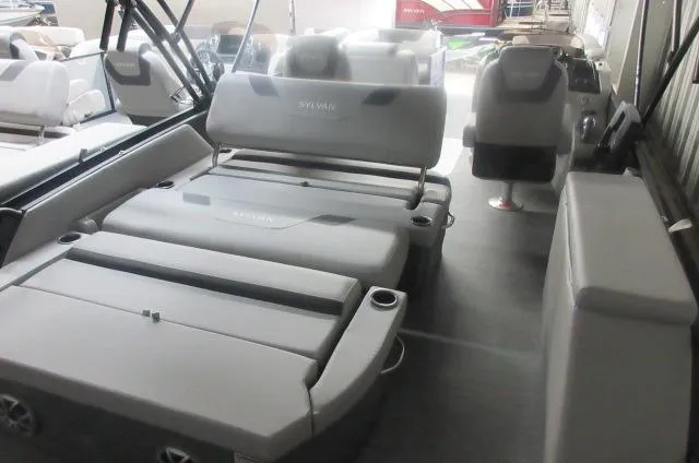 Slide: The Image of 2025 Sylvan L3 DLZ pontoon boat interior with gray seating and modern design. - 10