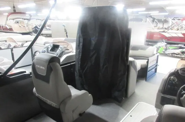 Slide: The Image of Interior of 2025 Sylvan L3 DLZ pontoon boat with seating and helm. - 4