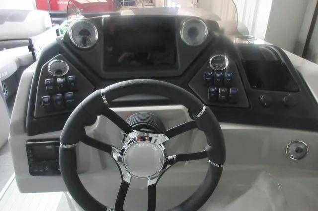 Slide: The Image of Steering console of 2025 Sylvan L3 DLZ boat with modern controls and dashboard. - 7