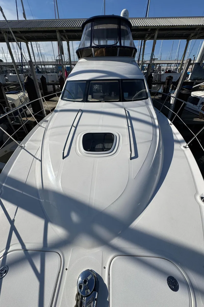 Slide: The Image of 2007 Sea Ray 44 Sedan Bridge yacht docked at marina. - 11
