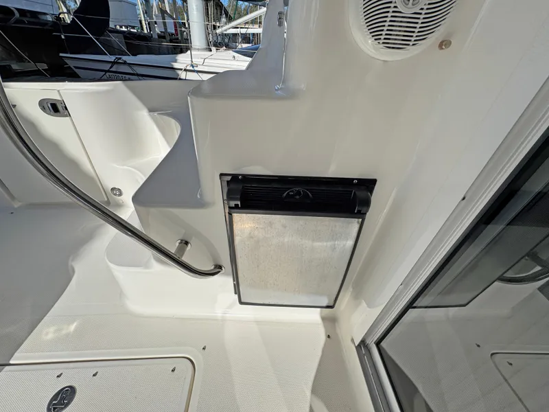 Slide: The Image of 2007 Sea Ray 44 Sedan Bridge interior with stainless steel appliance and speaker. - 16