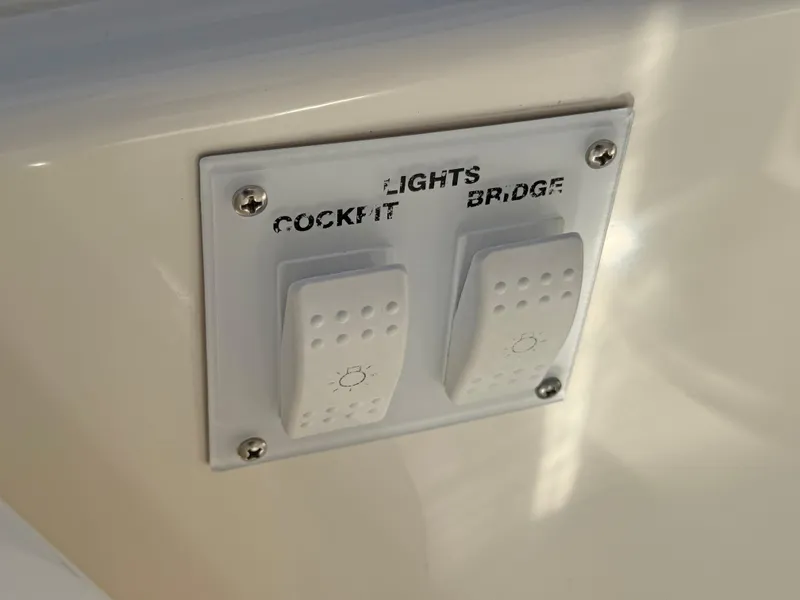 Slide: The Image of Light switches on 2007 Sea Ray 44 Sedan Bridge yacht cockpit and bridge. - 25