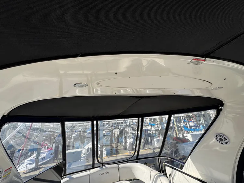 Slide: The Image of Interior view of 2007 Sea Ray 44 Sedan Bridge yacht with marina background. - 26