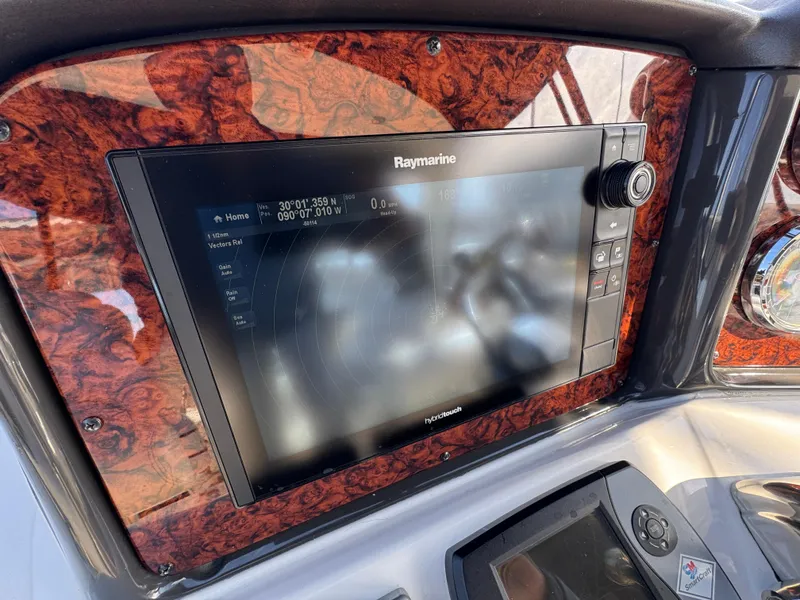 Slide: The Image of Raymarine navigation system on 2007 Sea Ray 44 Sedan Bridge yacht dashboard. - 30