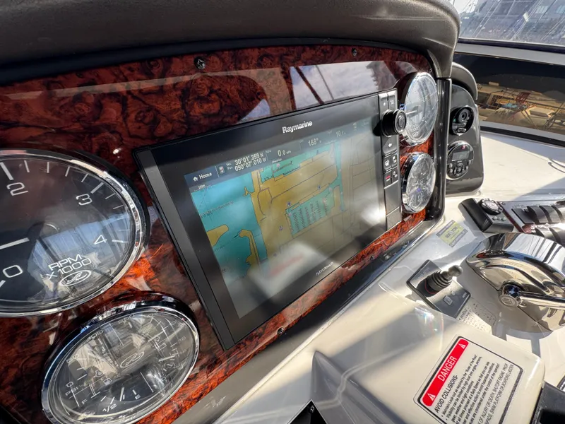 Slide: The Image of Dashboard of 2007 Sea Ray 44 Sedan Bridge with navigation system and gauges. - 31