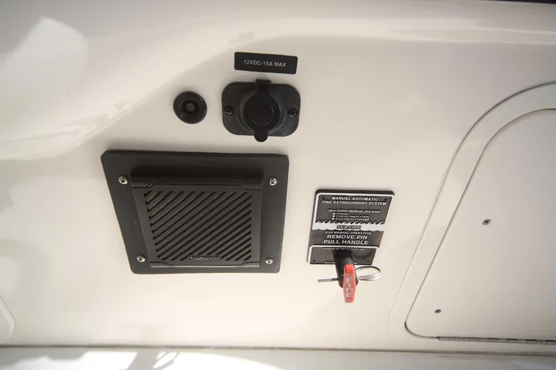 Slide: The Image of 2007 Sea Ray 44 Sedan Bridge control panel with switches and speaker. - 32