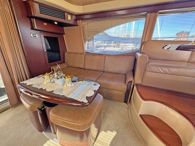 Slide: The Image of Luxurious interior of 2007 Sea Ray 44 Sedan Bridge yacht with leather seating and elegant decor. - 36