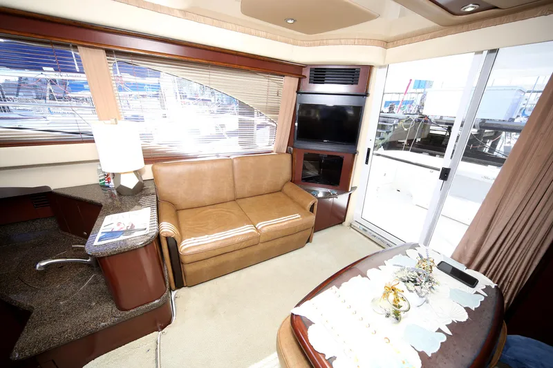 Slide: The Image of Luxurious interior of 2007 Sea Ray 44 Sedan Bridge yacht with leather seating and modern amenities. - 37