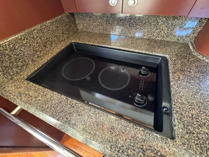 Slide: The Image of Granite countertop with built-in electric stove on 2007 Sea Ray 44 Sedan Bridge. - 41