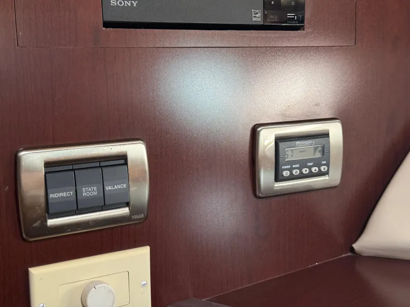 Slide: The Image of Control panel and switches on 2007 Sea Ray 44 Sedan Bridge yacht interior. - 49