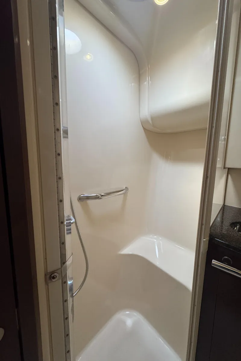 Slide: The Image of Shower area in 2007 Sea Ray 44 Sedan Bridge yacht, featuring sleek design and modern fixtures. - 52