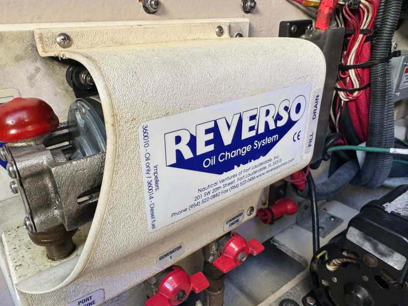 Slide: The Image of Reverso oil change system in a 2007 Sea Ray 44 Sedan Bridge engine room. - 58