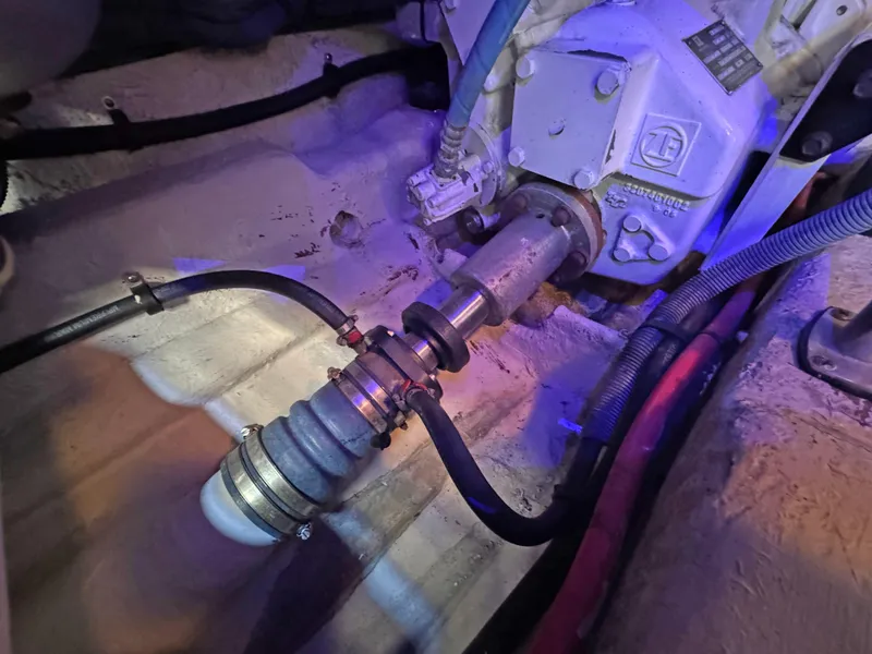 Slide: The Image of Engine compartment of 2007 Sea Ray 44 Sedan Bridge, showing mechanical components and hoses. - 59