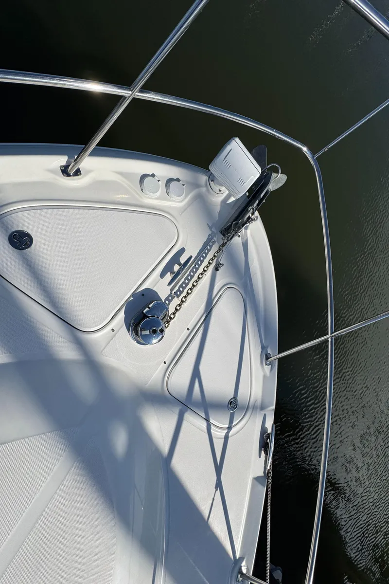 Slide: The Image of 2007 Sea Ray 44 Sedan Bridge boat deck with anchor and railing. - 8