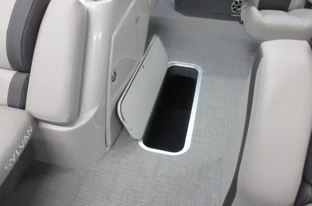 Slide: The Image of 2025 Sylvan L3 DLZ boat interior with open storage compartment. - 2