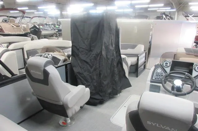 Slide: The Image of 2025 Sylvan L3 DLZ pontoon boat interior with modern seating and controls. - 4