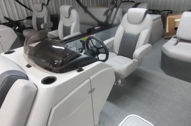 Slide: The Image of 2025 Sylvan L3 DLZ boat interior with modern seating and steering console. - 5