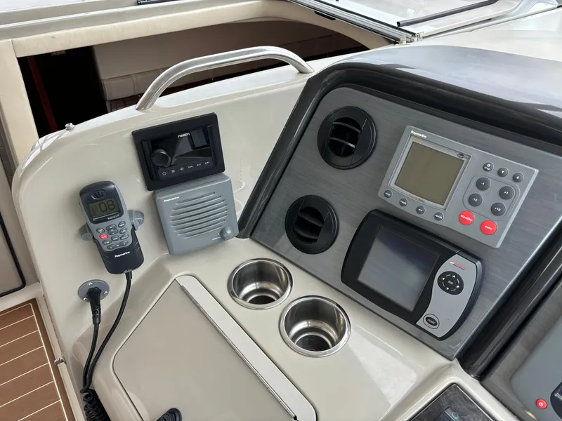 Slide: The Image of 2006 Sea Ray 40 Motor Yacht helm with navigation controls and communication devices. - 11