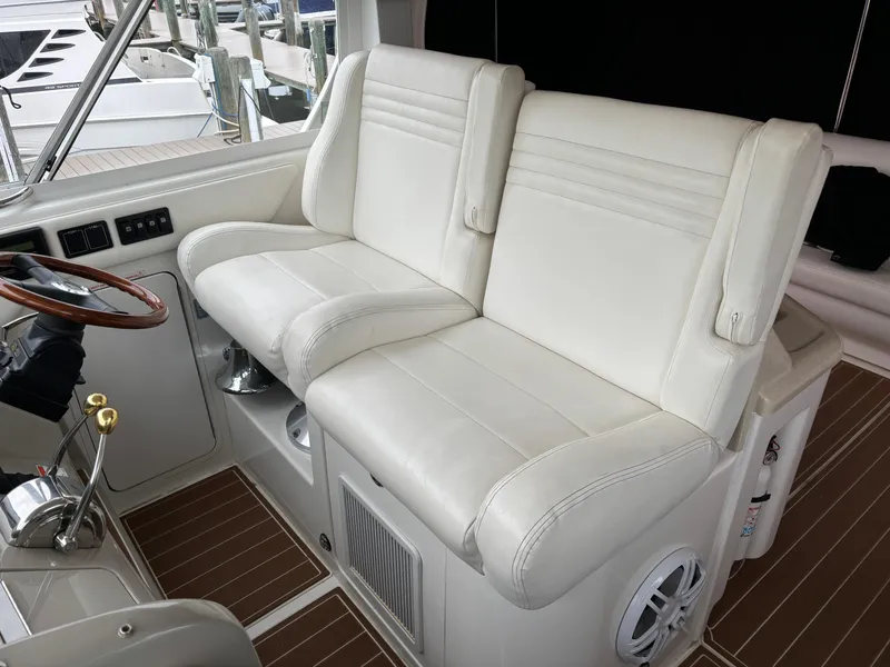 Slide: The Image of Luxurious white seating on 2006 Sea Ray 40 Motor Yacht helm. - 13