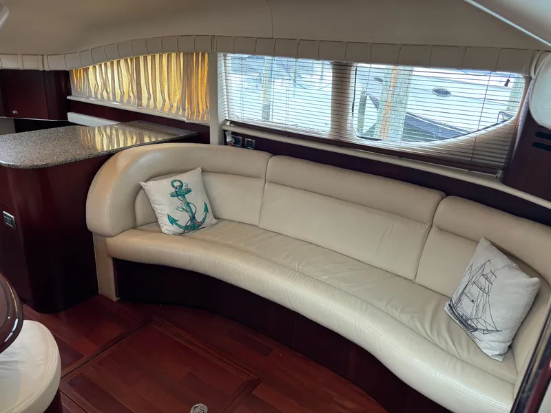 Slide: The Image of Luxurious interior of 2006 Sea Ray 40 Motor Yacht with curved leather seating. - 16