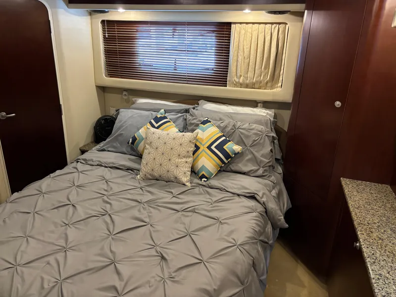 Slide: The Image of Luxurious bedroom in 2006 Sea Ray 40 Motor Yacht with stylish bedding and wood accents. - 26