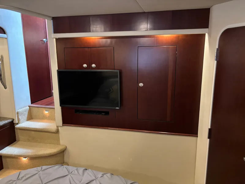 Slide: The Image of Interior of 2006 Sea Ray 40 Motor Yacht with TV and wooden cabinetry. - 29