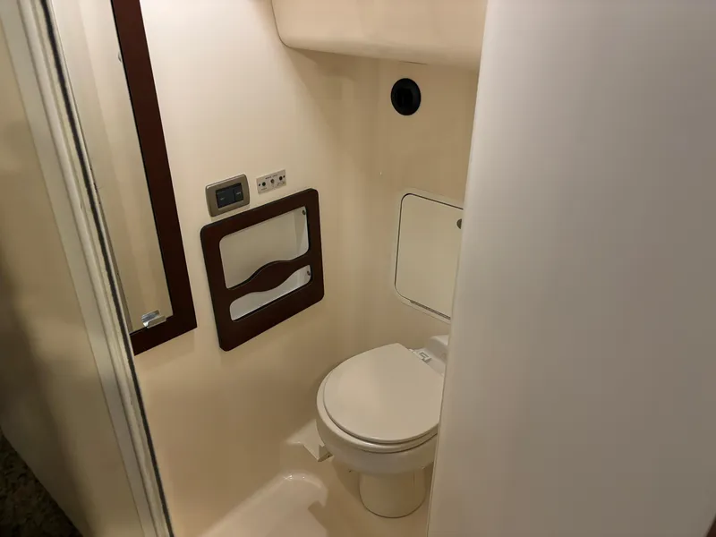 Slide: The Image of 2006 Sea Ray 40 Motor Yacht bathroom interior with toilet and mirror. - 30
