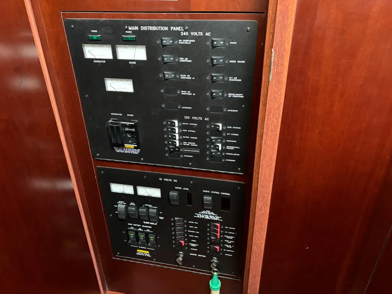 Slide: The Image of Electrical control panel on 2006 Sea Ray 40 Motor Yacht, featuring switches and gauges. - 32