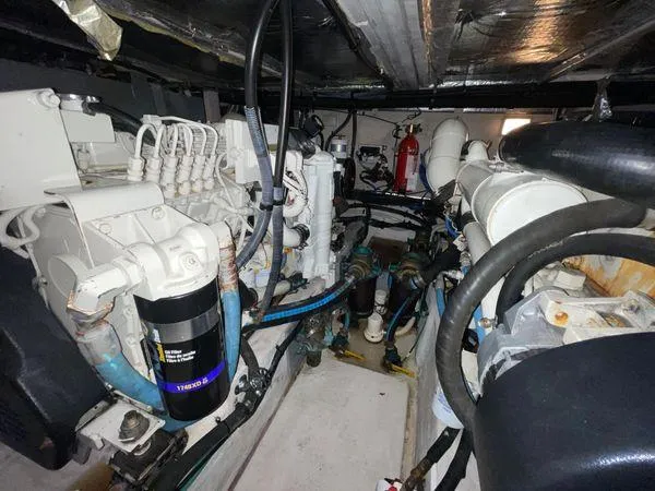 Slide: The Image of Engine room of 2006 Sea Ray 40 Motor Yacht, showcasing mechanical components and systems. - 34