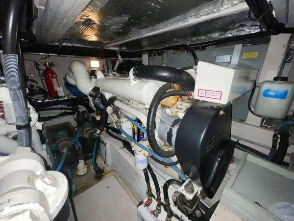 Slide: The Image of Engine room of 2006 Sea Ray 40 Motor Yacht, showcasing mechanical components and systems. - 35