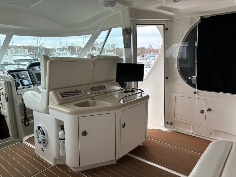 Slide: The Image of Interior of 2006 Sea Ray 40 Motor Yacht with helm, sink, and seating area. - 6