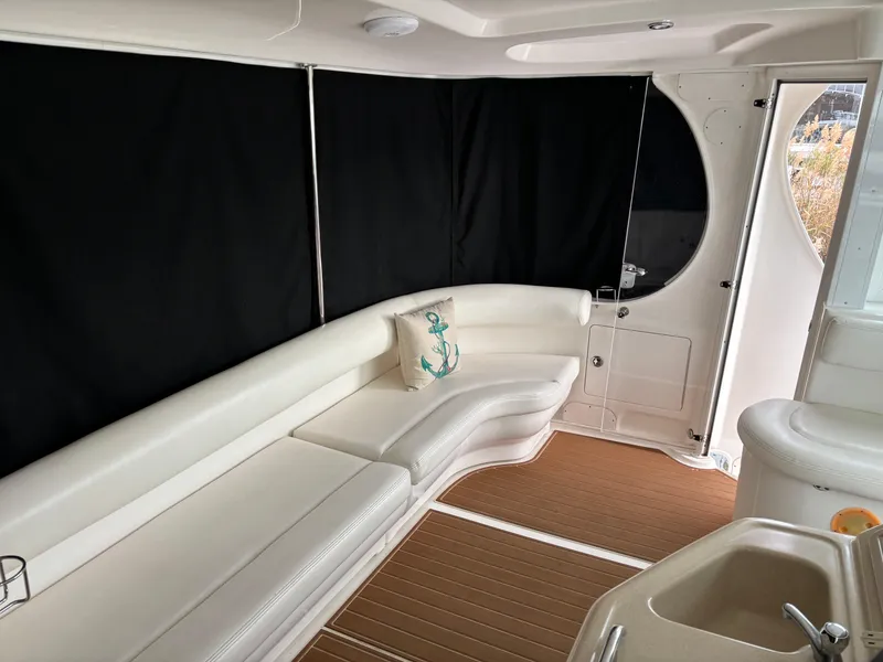 Slide: The Image of Luxurious interior of 2006 Sea Ray 40 Motor Yacht with white seating and nautical decor. - 7