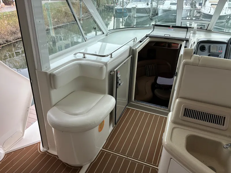 Slide: The Image of 2006 Sea Ray 40 Motor Yacht interior with seating and helm area. - 8