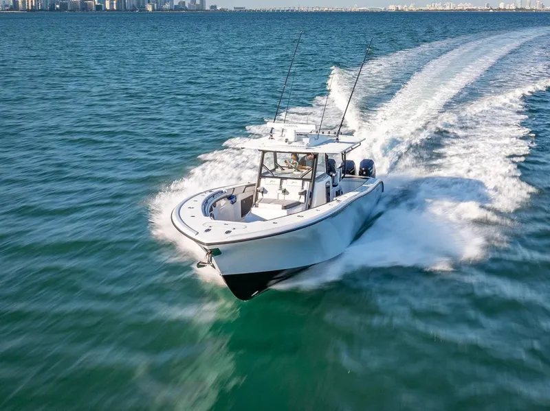 Slide: The Image of 2024 Yellowfin 42 boat cruising on open water. - 11