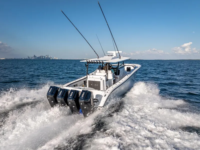 Slide: The Image of 2024 Yellowfin 42 boat cruising on open water with triple outboard engines. - 17