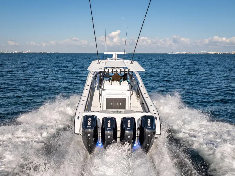 Slide: The Image of 2024 Yellowfin 42 boat cruising on open water with powerful engines. - 19