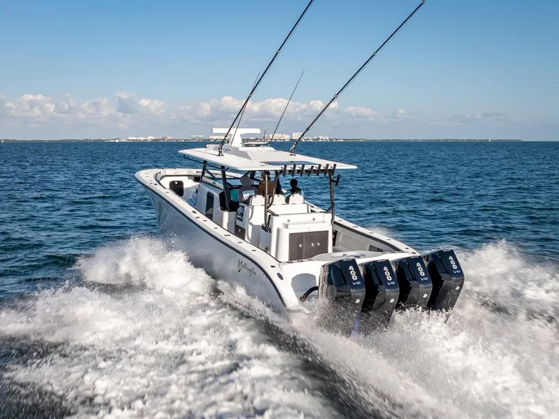 Slide: The Image of 2024 Yellowfin 42 boat cruising on open water with powerful engines. - 20
