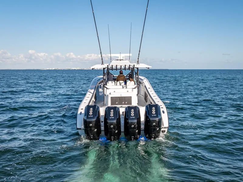 Slide: The Image of 2024 Yellowfin 42 boat with four powerful engines cruising on open water. - 21