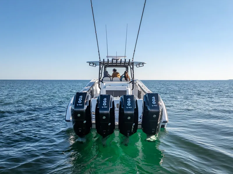 Slide: The Image of 2024 Yellowfin 42 boat with four powerful outboard engines on open water. - 33