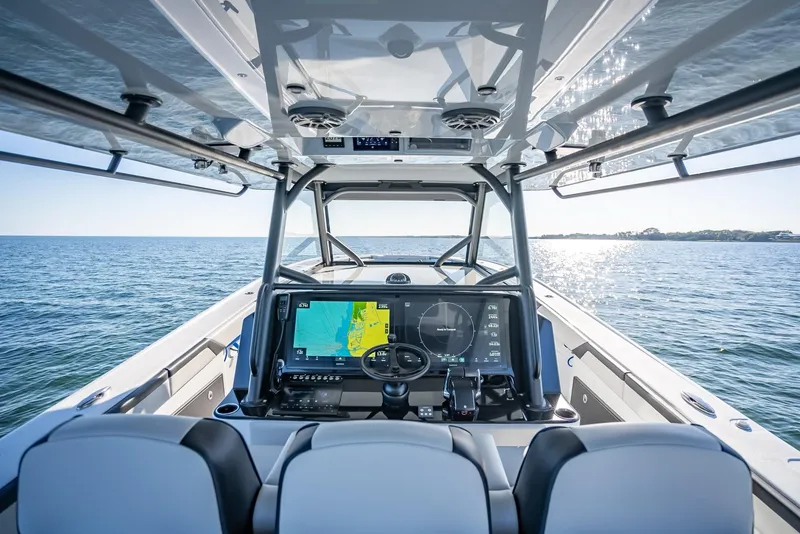 Slide: The Image of 2024 Yellowfin 42 boat interior with advanced navigation system on open water. - 34