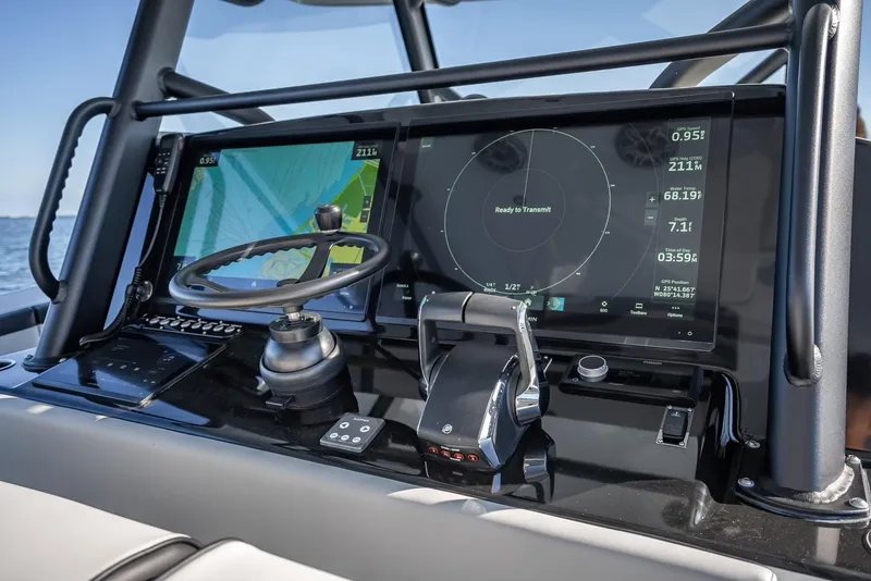 Slide: The Image of 2024 Yellowfin 42 boat dashboard with advanced navigation screens and controls. - 37