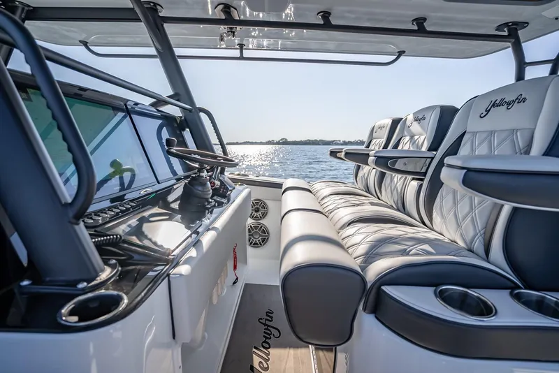 Slide: The Image of 2024 Yellowfin 42 boat interior with luxurious seating and ocean view. - 42