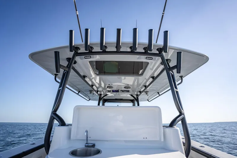 Slide: The Image of 2024 Yellowfin 42 boat with fishing rod holders and sink, ocean view. - 47
