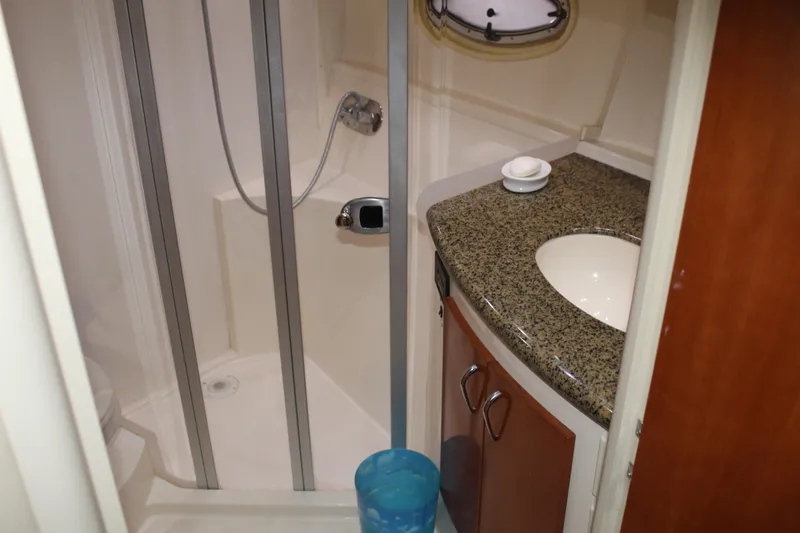 Slide: The Image of Bathroom interior of 2004 Carver 360 Mariner with shower and granite countertop. - 23