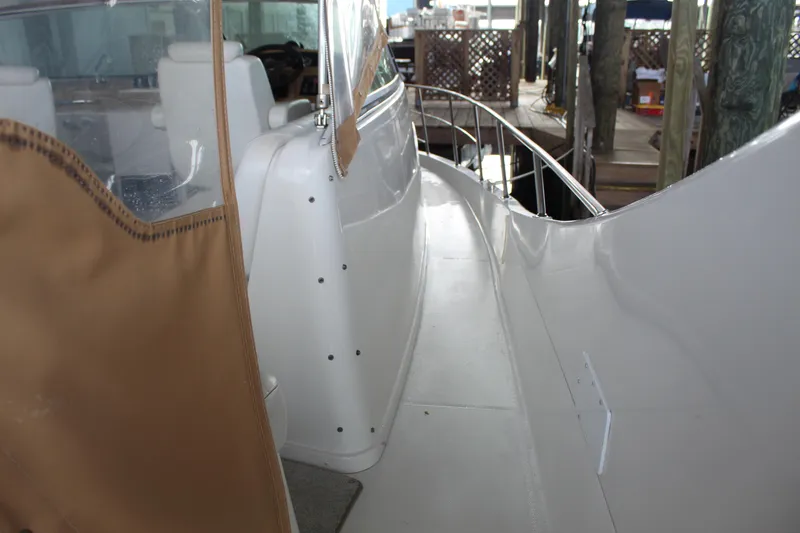 Slide: The Image of 2004 Carver 360 Mariner yacht deck with railing and tan cover. - 15